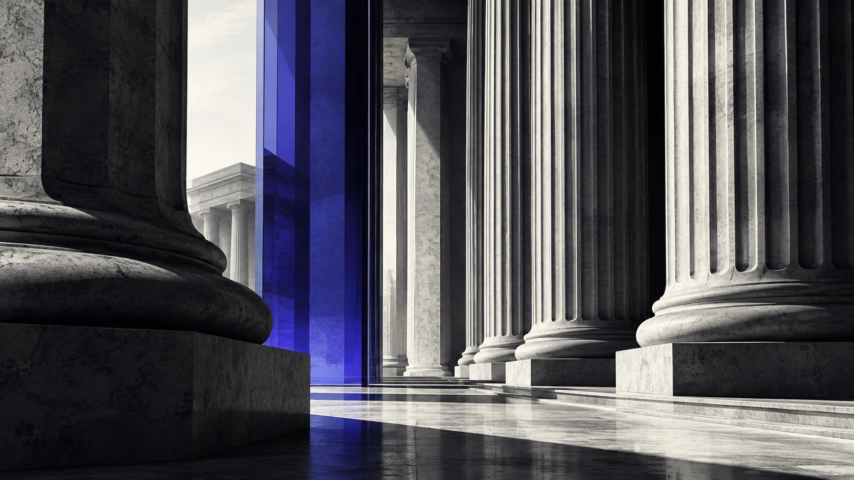 Stone banking columns intersected by blue glass.